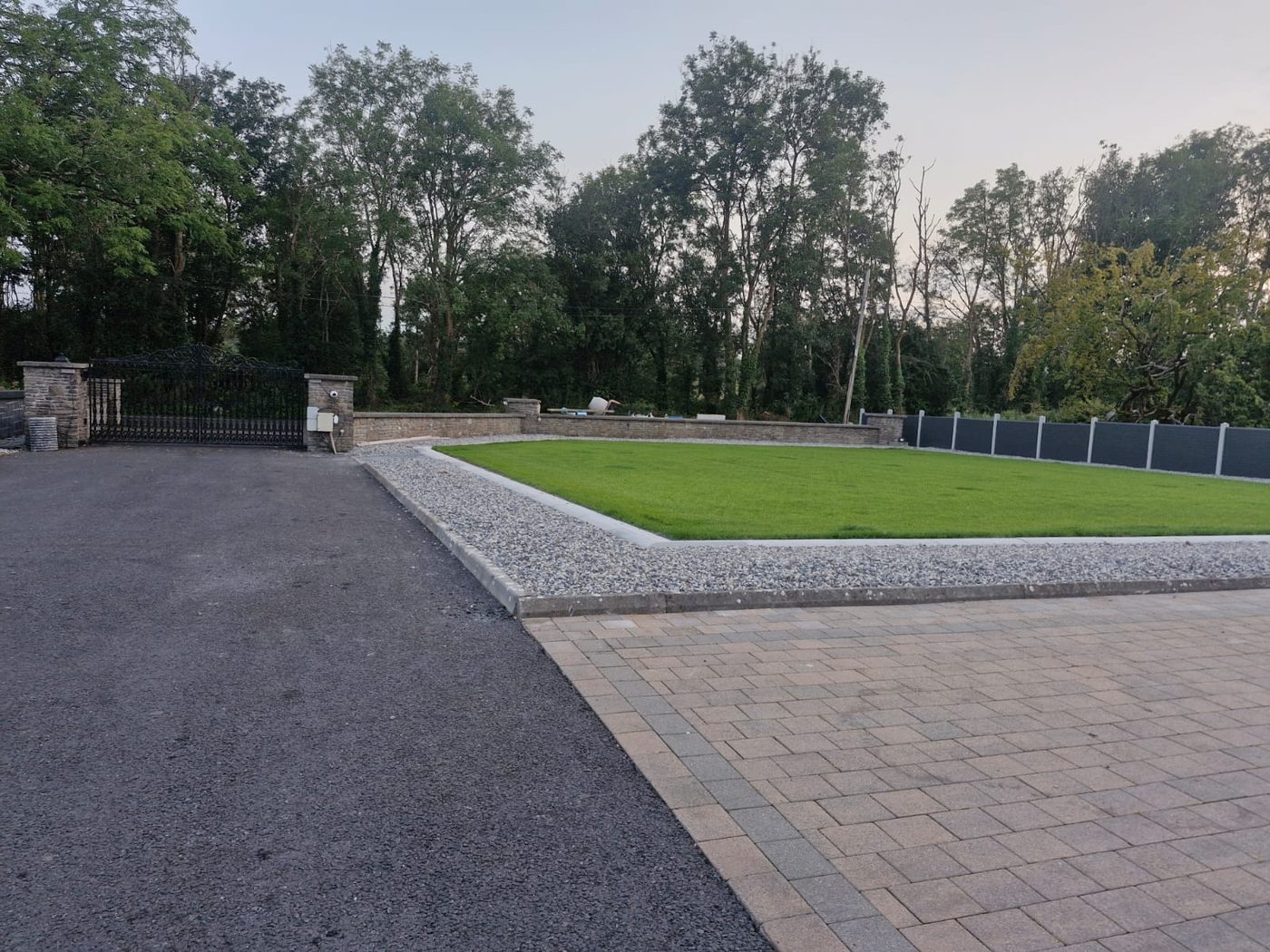 Lawn, block paving and mature trees